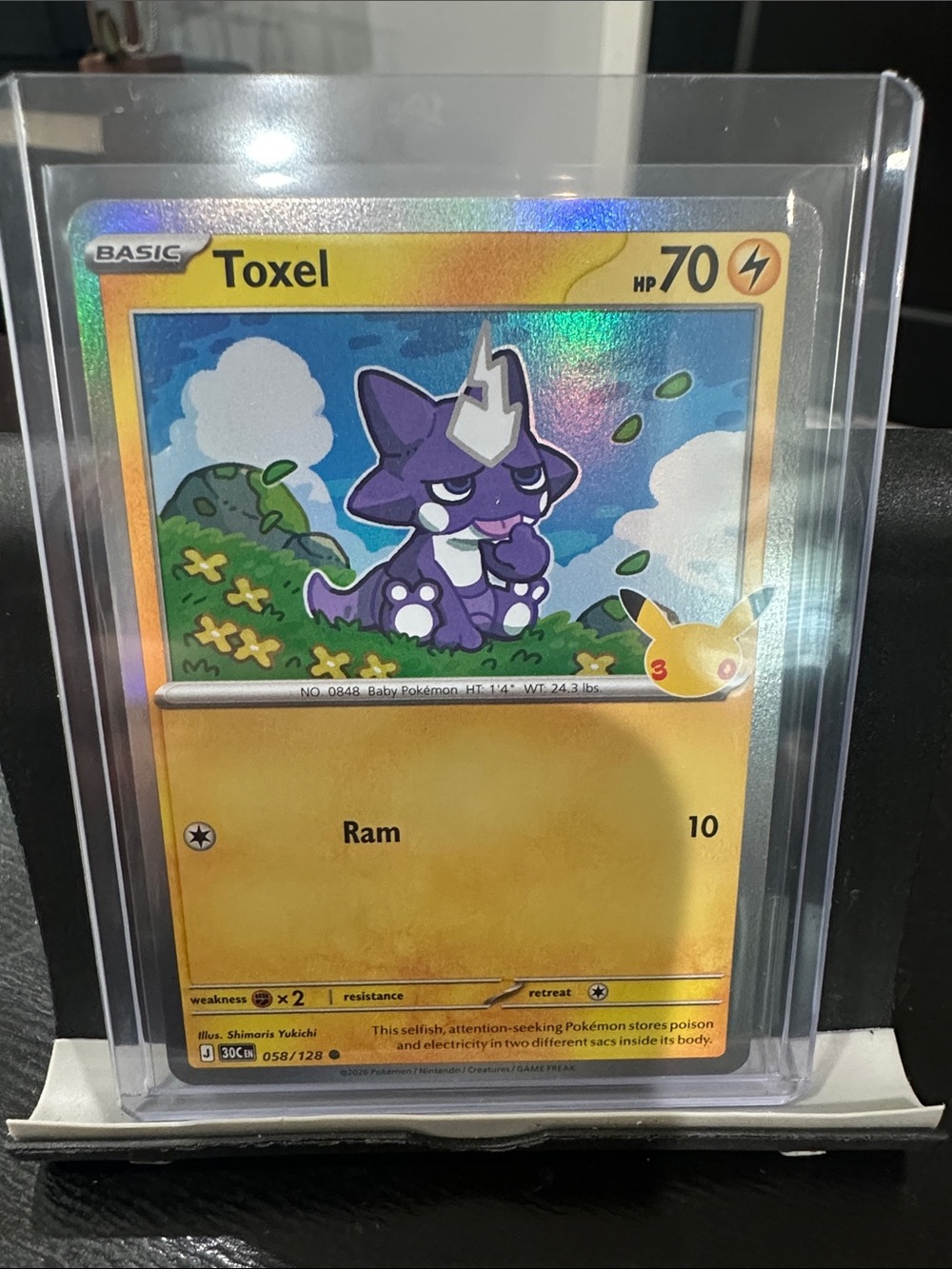 Pokemon 30th Anniversary Toxel Holo Yellow and Purple Collectible Card
